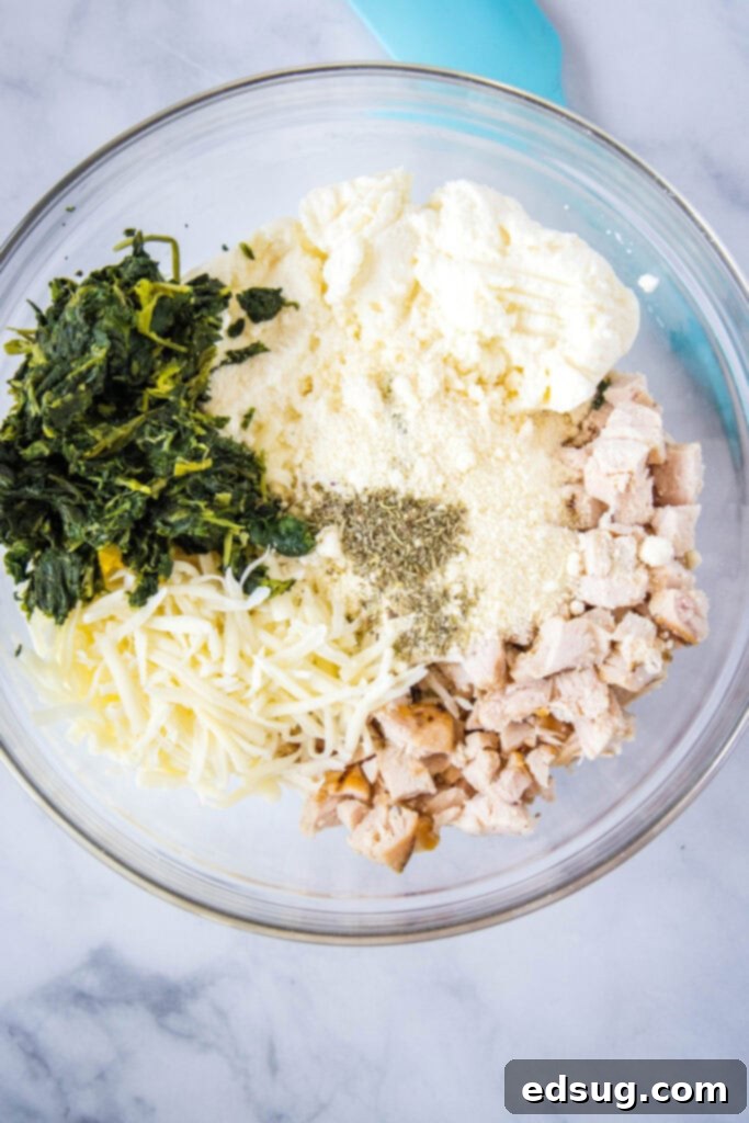 Creamy Chicken Stuffed Shells 3 Alfredo stuffed shells ingredients in a mixing bowl, ready to be combined for the filling