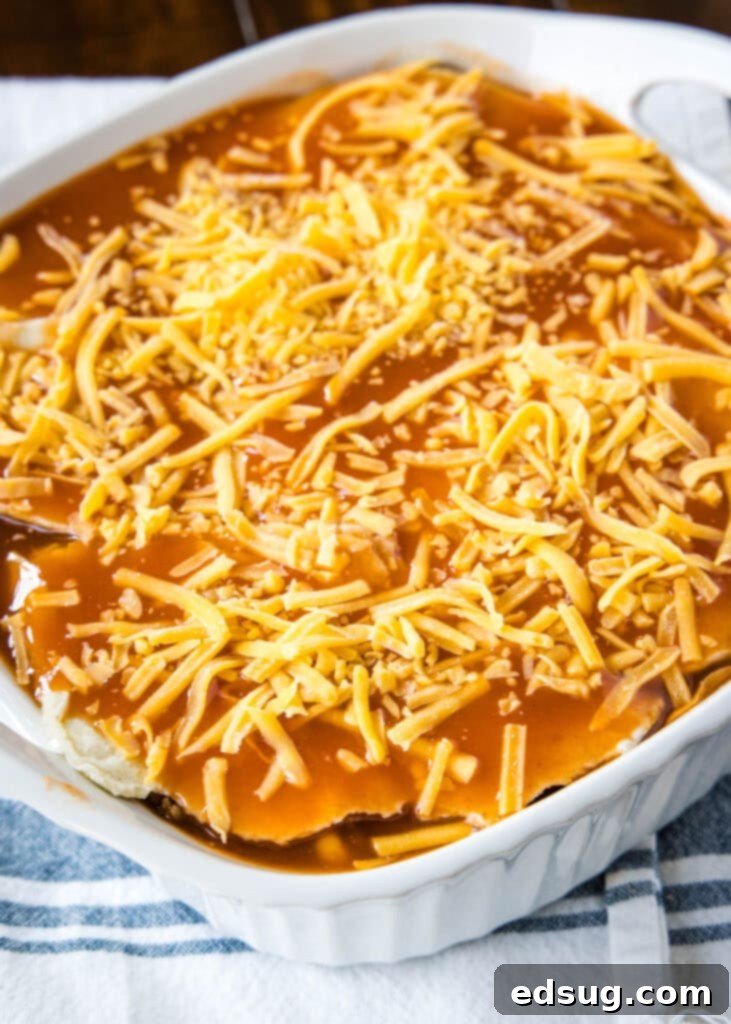 Cheesy Beef Enchilada Delight 3 enchilada casserole ready for the oven