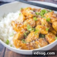 cropped in image of bourbon chicken topped with sesame seeds