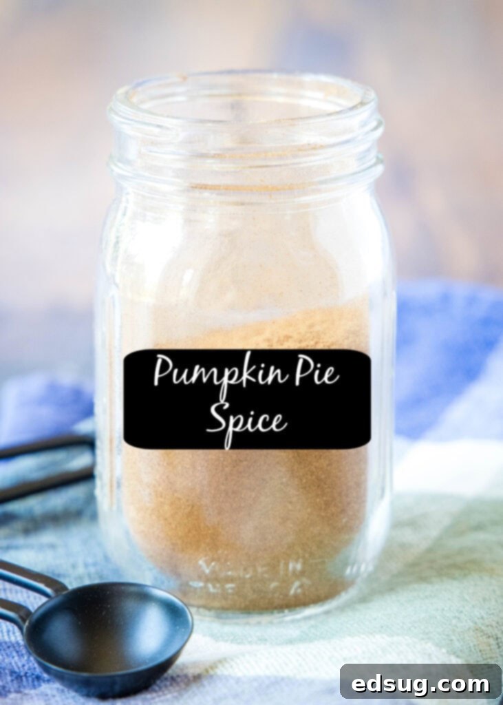 Warm Pumpkin Spice Mix 2 Labeled jar of homemade pumpkin pie spice on a wooden surface, ready for use in fall recipes.