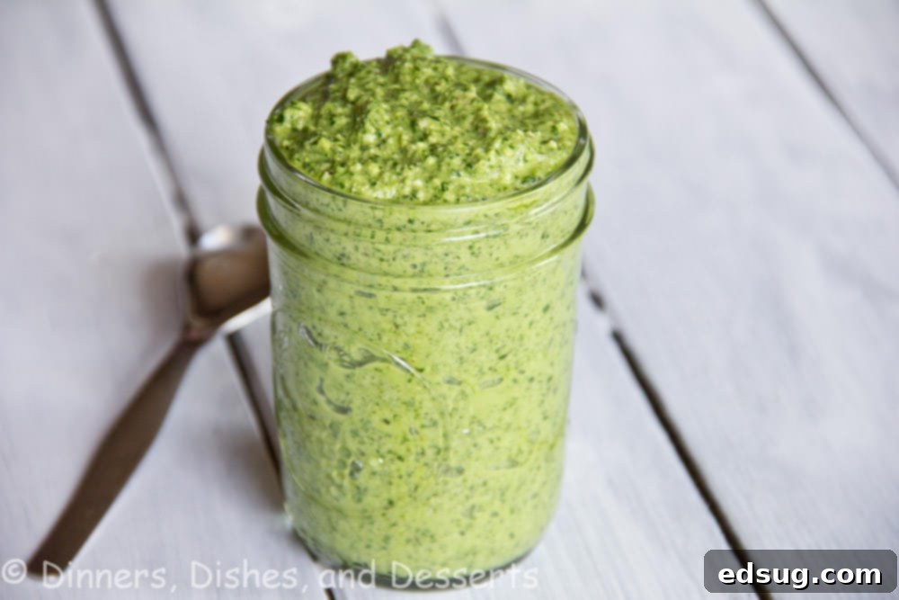 arugula walnut pesto in a jar, ready for serving