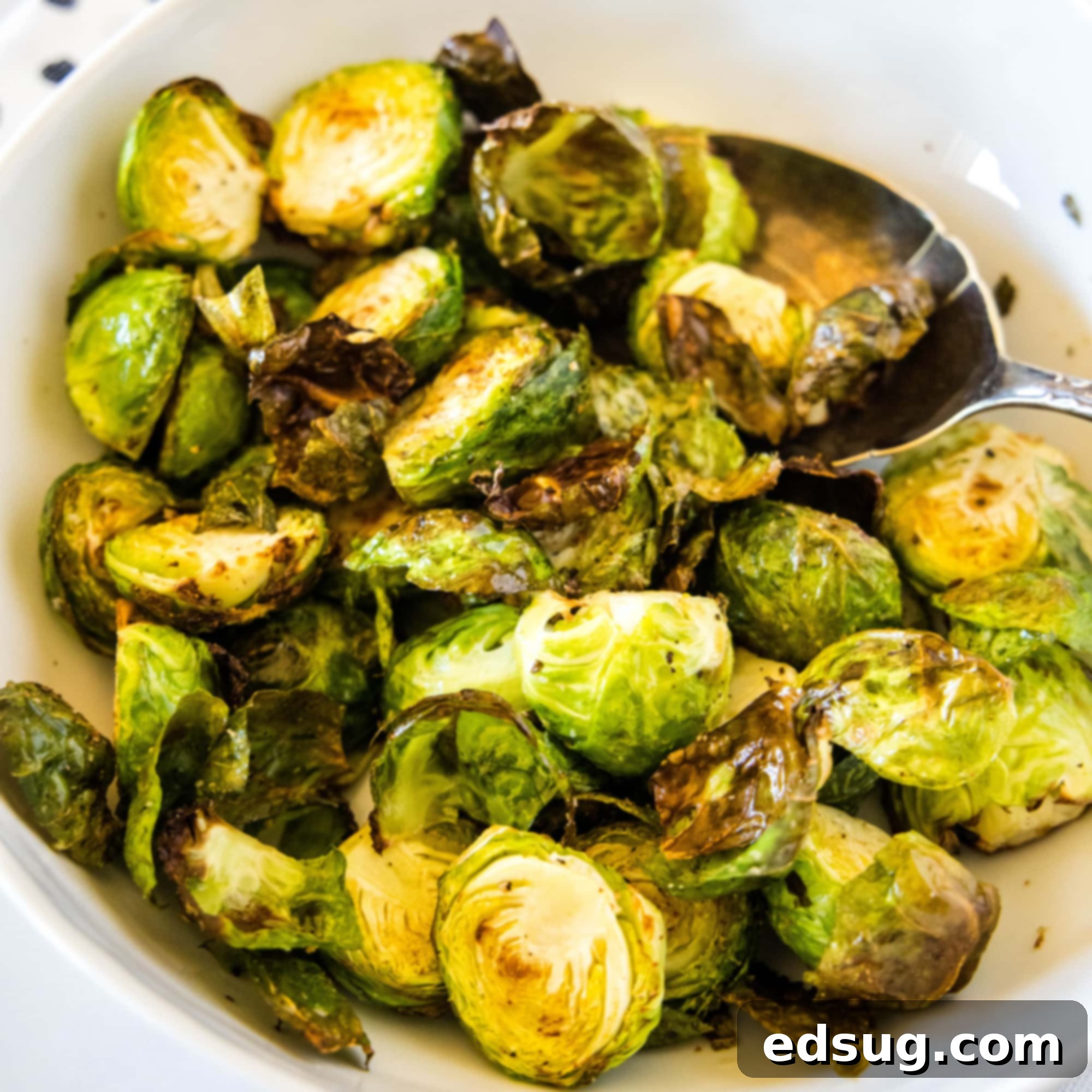 cropped in close of up brussel sprouts in a white bowl