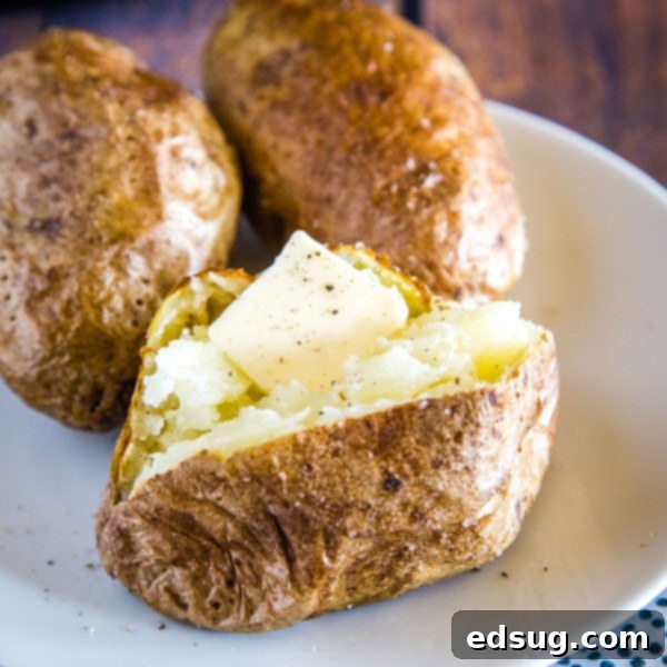 cropped image of potato with butter on it