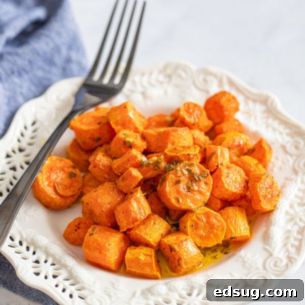 cooked carrots on a plate with fork