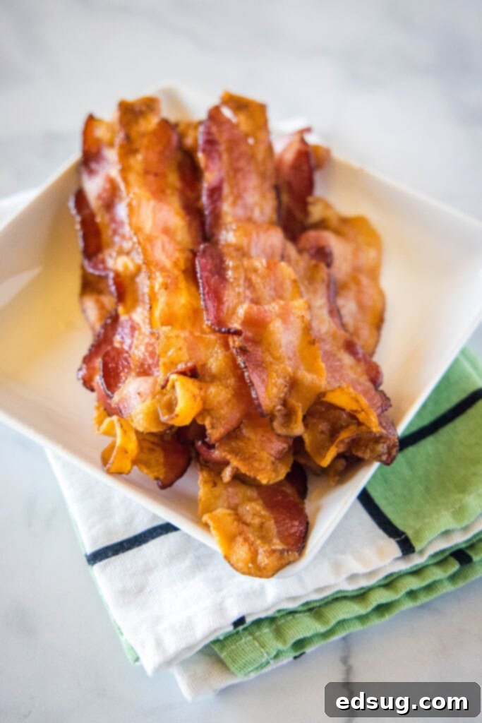 Perfect Air Fryer Bacon 5 bacon on a white plate