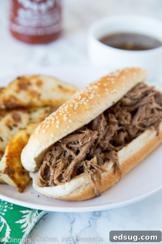 Slow Cooker French Dip - juicy tender beef cooked in a savory broth and served on a French roll. Au jus is great for dipping and make this crock pot recipe a staple in any house! Crock Pot French Dip Recipe with ingredients laid out
