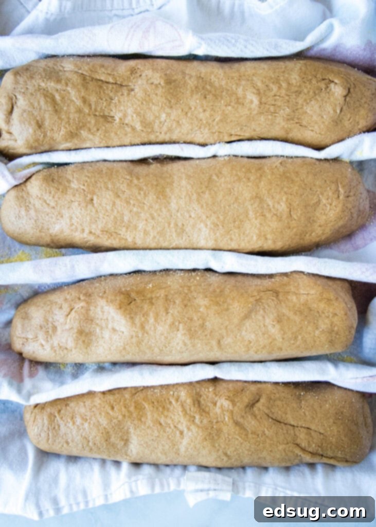 shaped brown bread down on baking sheet