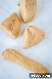 portions of brown bread dough on counter