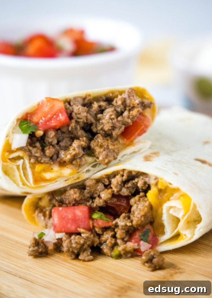 Taco Bell Copycat Meximelt Recipe 2 meximelt cut in half on a cutting board