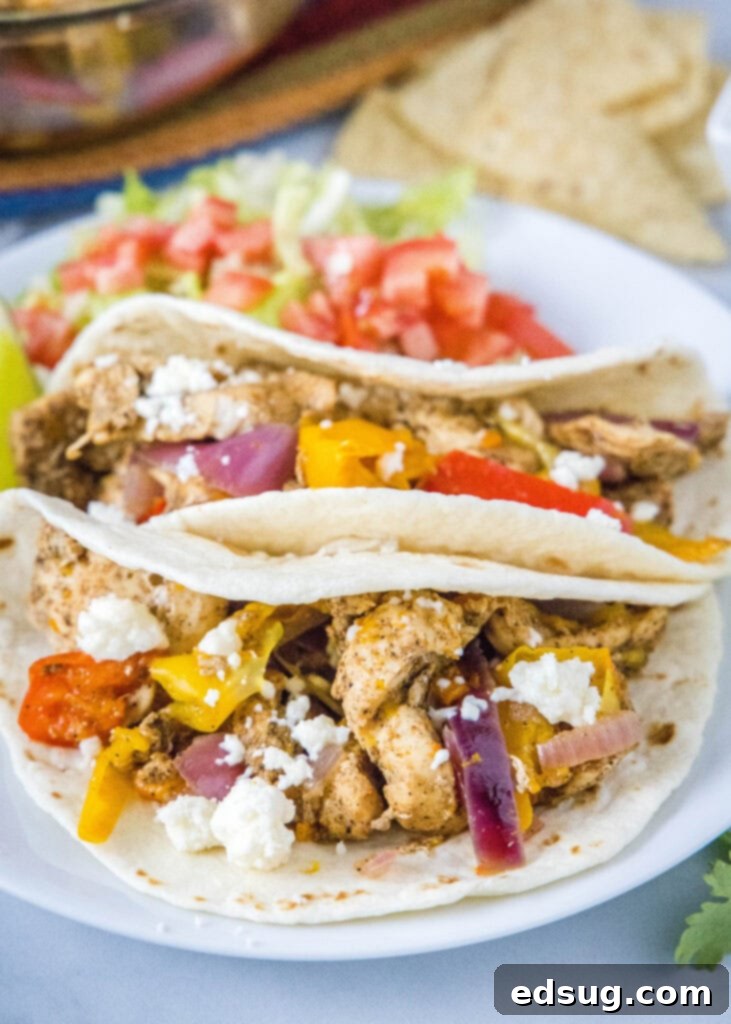 Instant Pot Chicken Fajitas served in warm tortillas with fresh toppings.