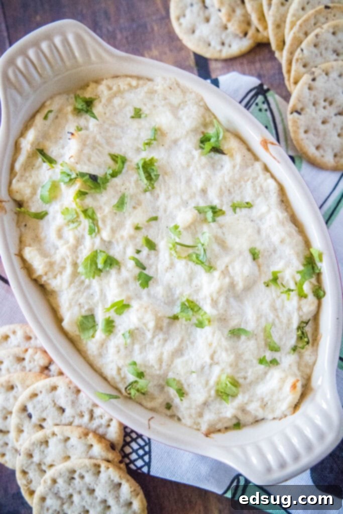 Hot Crab Rangoon Dip 2 looking down on baking dish of crab dip