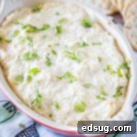 Hot Crab Rangoon Dip 7 close up crab dip in baking dish