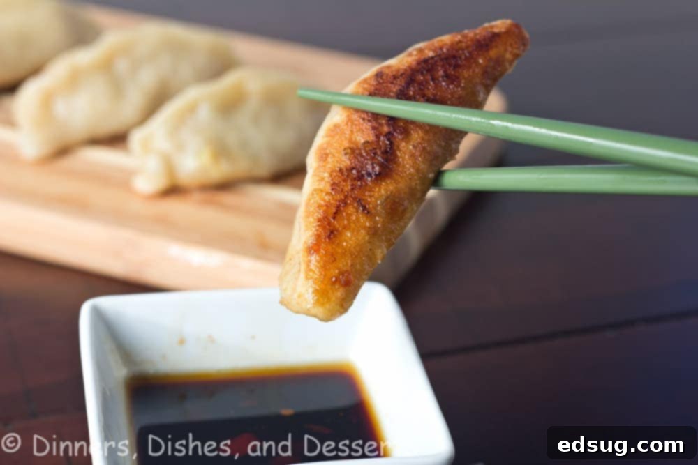 Pan Fried Shrimp and Pork Potstickers pan fried shrimp and pork potstickers on a board