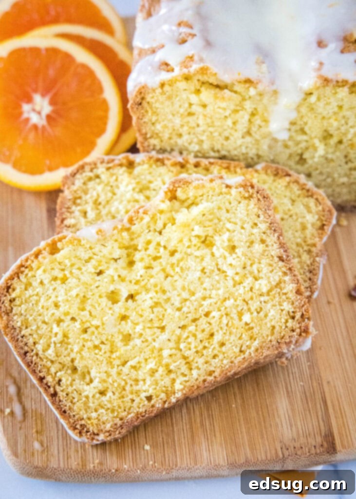 Zesty Orange Loaf 5 sliced orange bread topped with a delicate orange glaze