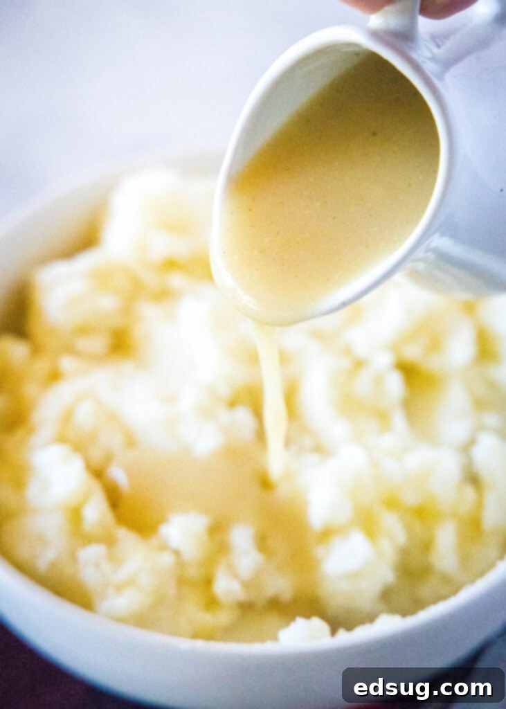 Foolproof Homemade Gravy 4 pouring gravy over mashed potatoes