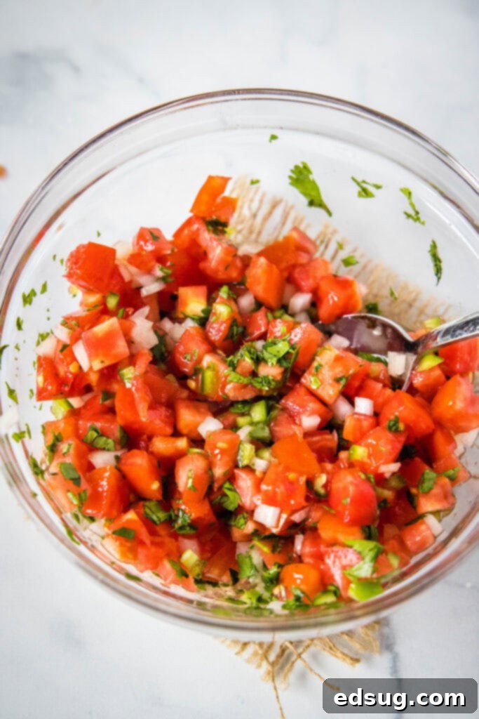 Classic Fresh Salsa 4 mixing pico de gallo together in a mixign bowl