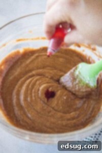 Ruby Red Indulgence 8 adding food coloring to brownie batter