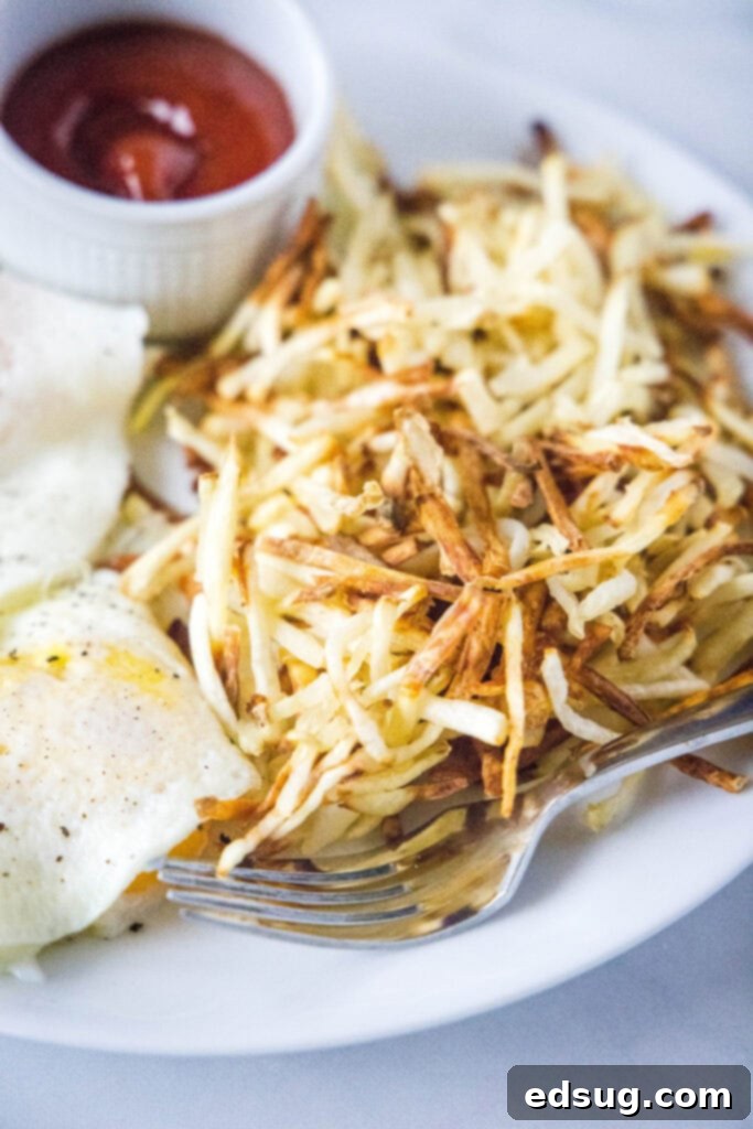 shredded hash browns and eggs on a plate