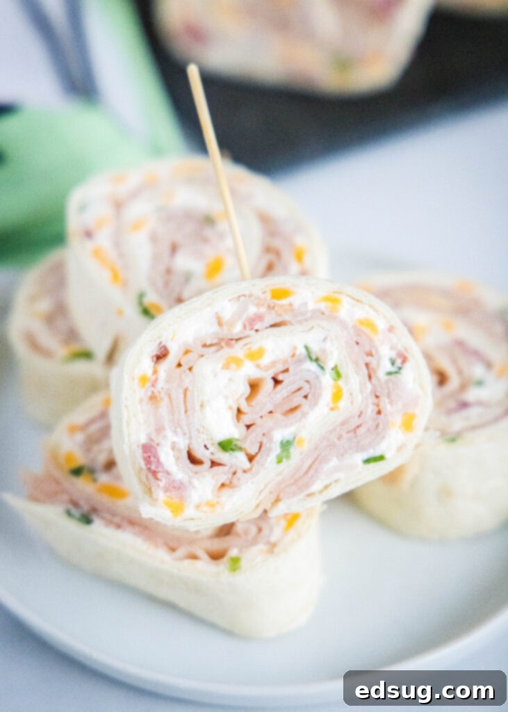 pinwheel sandwiches arranged on a white plate