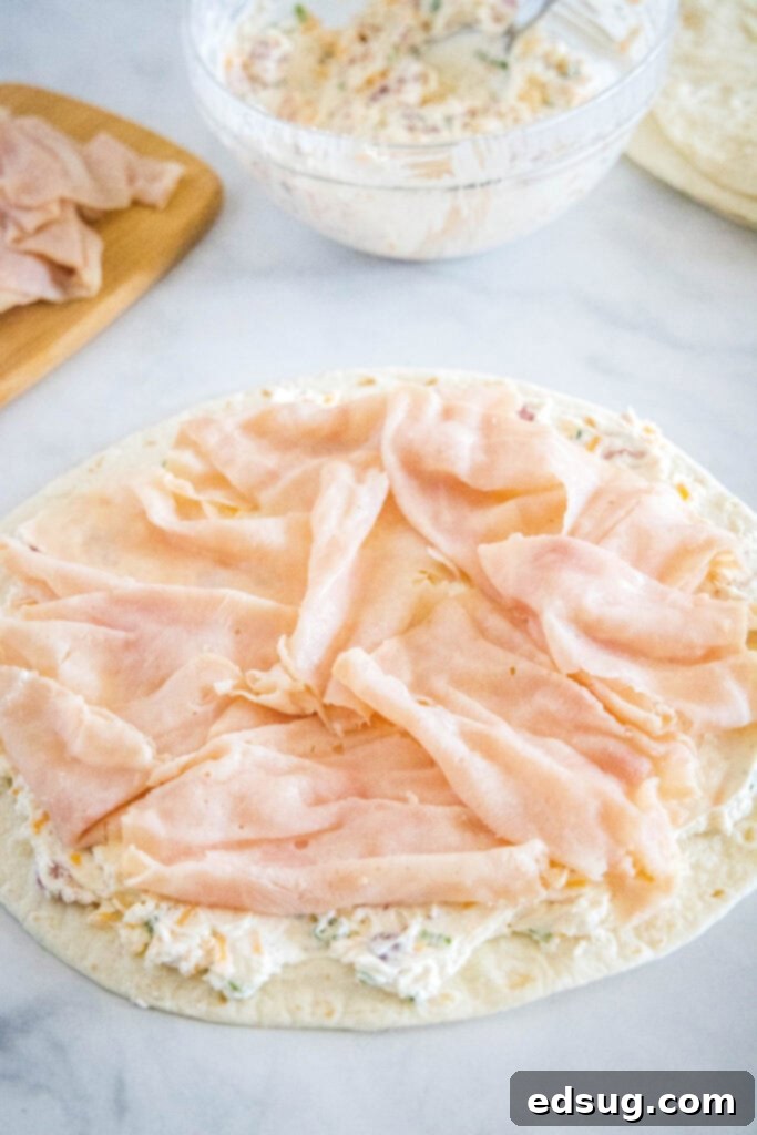 adding sliced turkey over cream cheese mixture