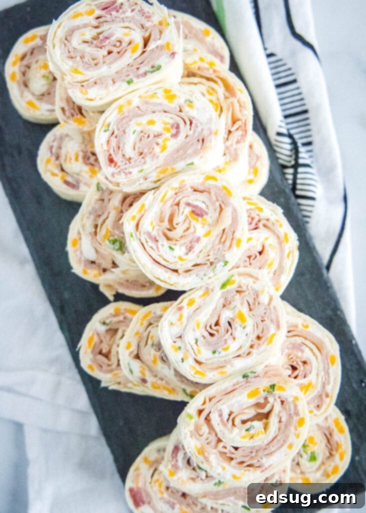 stacked turkey pinwheels on a serving platter
