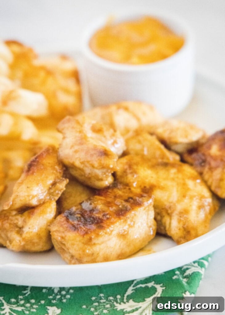 Signature Grilled Chicken Bites 6 Plated grilled chicken nuggets, perfectly cooked and ready to eat