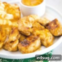 Signature Grilled Chicken Bites 8 close up grilled chicken pieces on a white plate