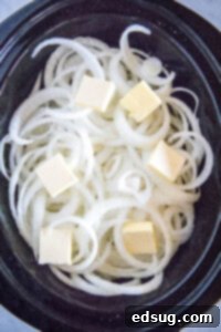 sliced onions and butter in a crockpot