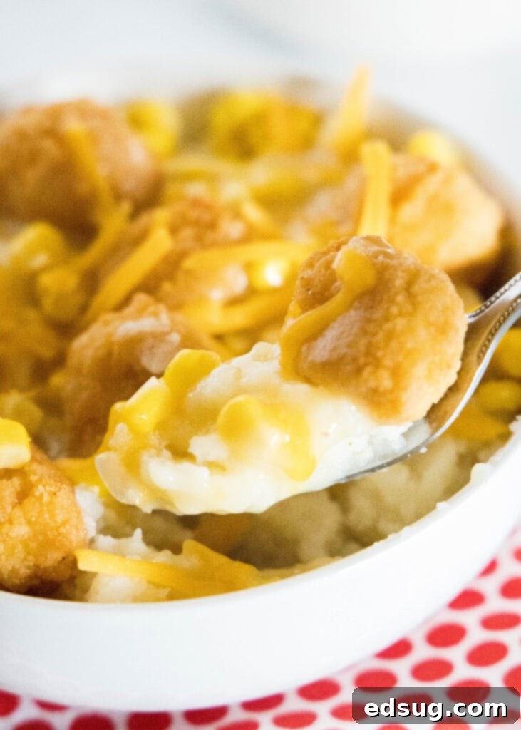 DIY KFC Famous Bowl 5 taking a bite of a homemade kfc bowl