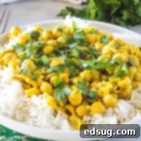 Golden Chickpea Delight 7 close up chickpea curry on a white plate