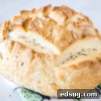 Baked Amish bread on top of a dishcloth.