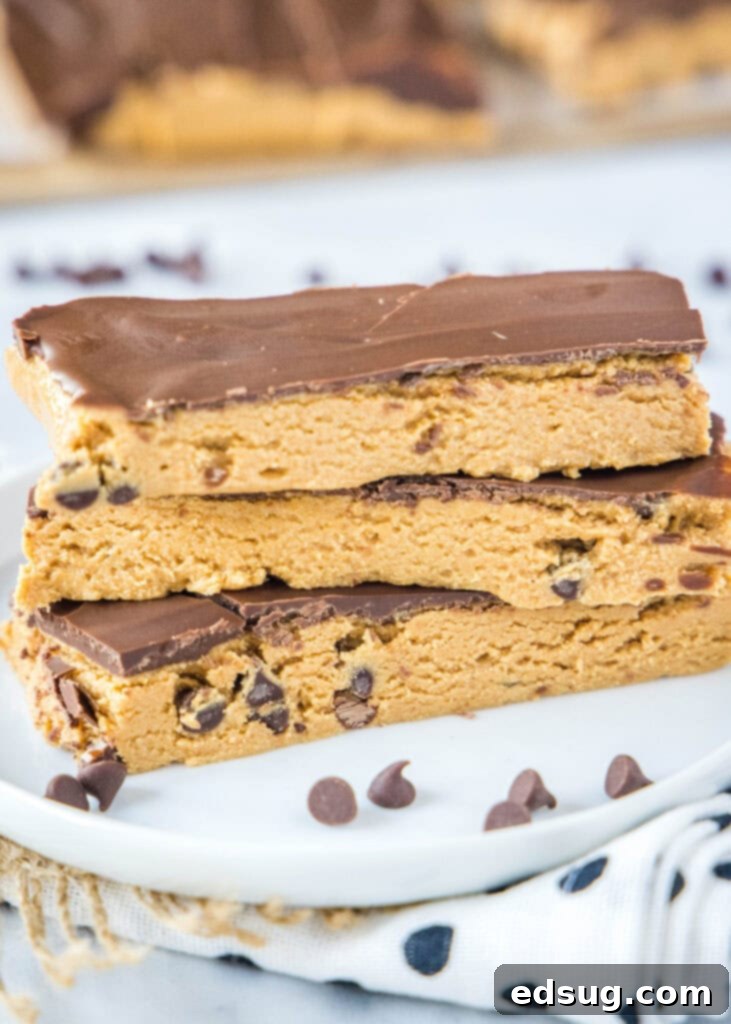 Power-Packed Peanut Butter Protein Bars 2 peanut butter protein bars on a white plate