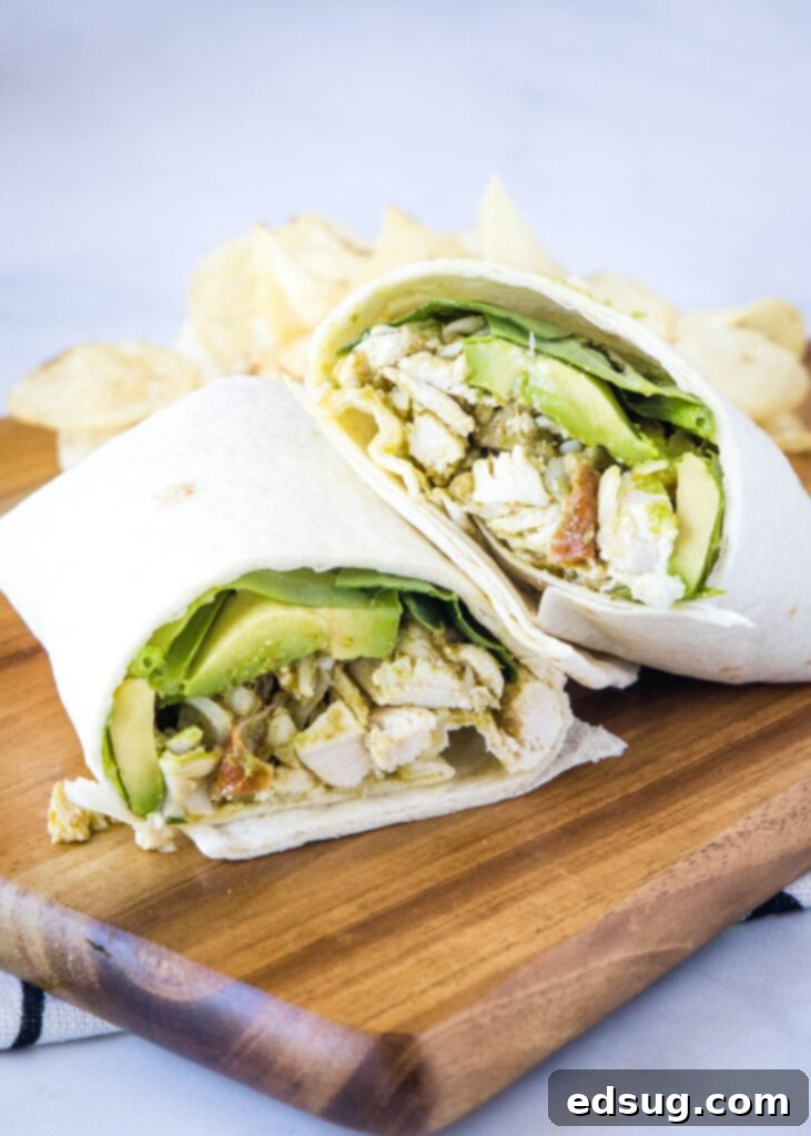 Pesto Chicken Delights 2 chicken pesto wraps on a cutting board