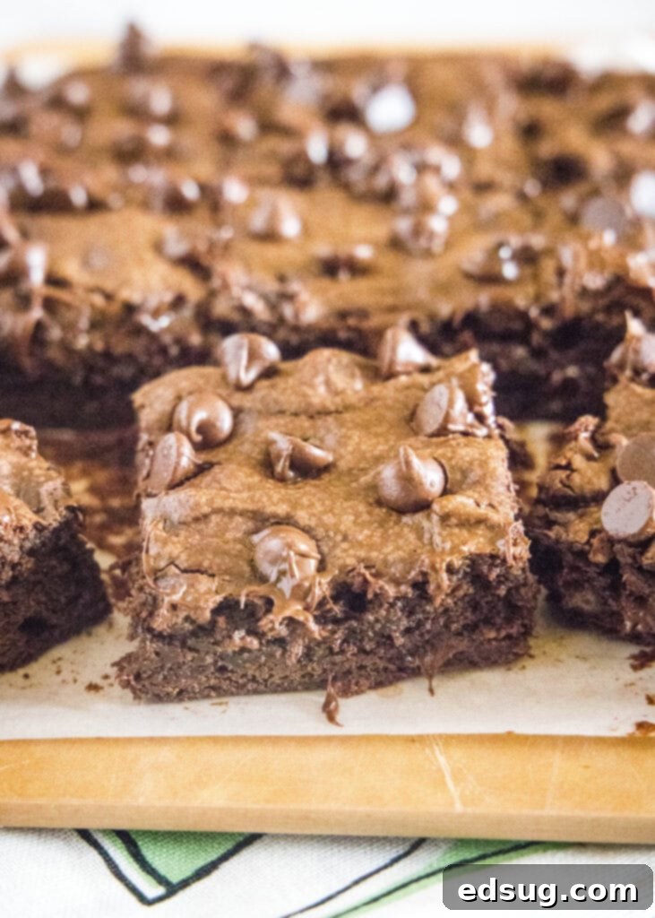 Decadent Avocado Brownies 4 avocado brownies on a cutting board cut into squares