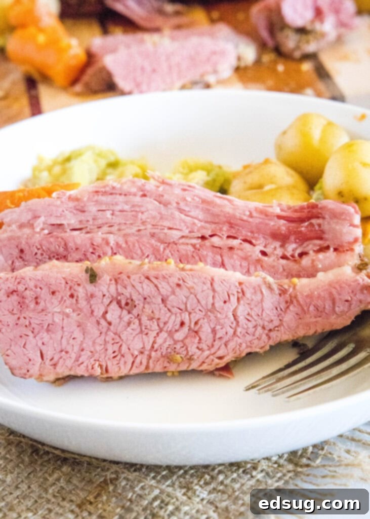 Perfect Instant Pot Corned Beef 6 A hearty plate of Instant Pot corned beef and cabbage, garnished with parsley