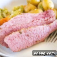 Perfect Instant Pot Corned Beef 9 close up sliced corned beef on a plate