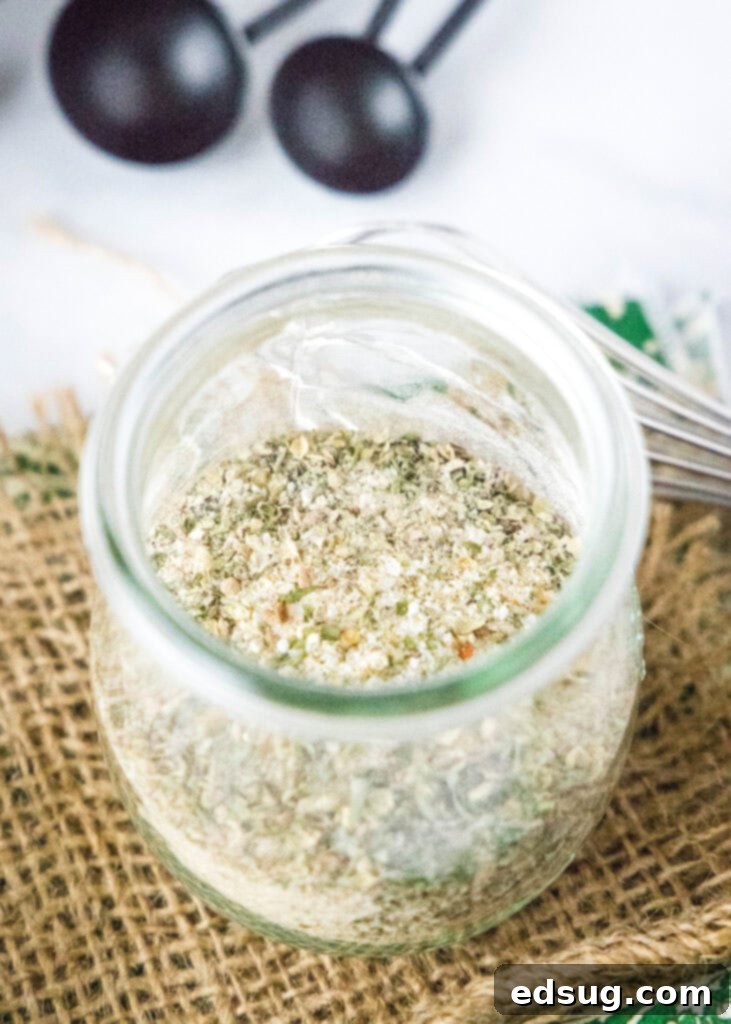 Classic Italian Salad Mix 4 A small glass jar filled with the freshly made Italian dressing mix, showcasing its rich, earthy colors.