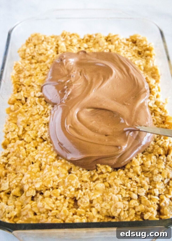 pouring chocolate over special k bars