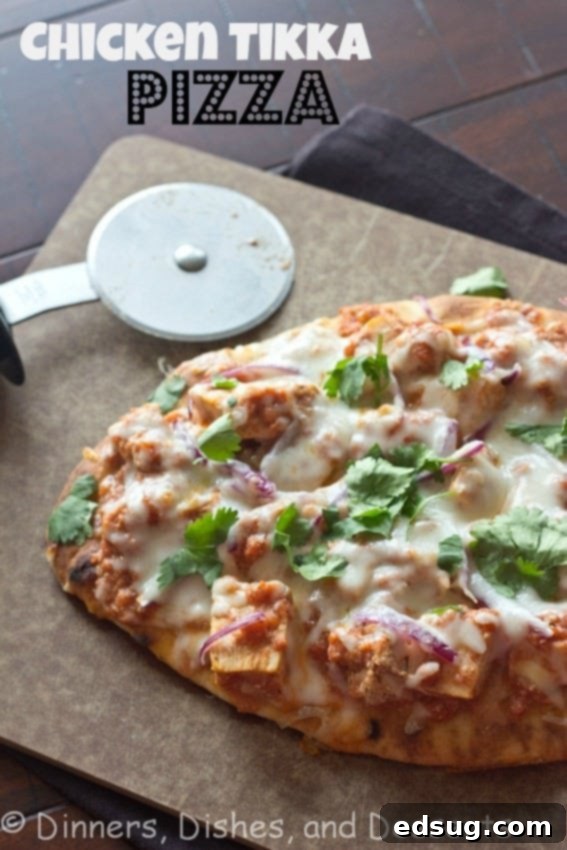 Chicken Tikka Pizza | Dinners, Dishes, and Desserts Delicious chicken tikka pizza served on a rustic wooden board, ready to be enjoyed.