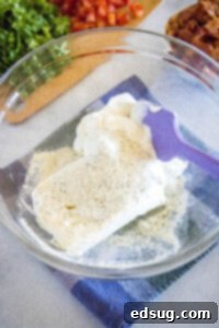 sour cream, cream cheese, ranch seasoning in a mixing bowl