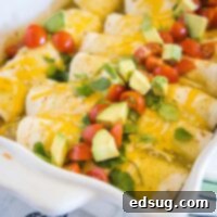 close up breakfast enchiladas with avocado and tomatoes