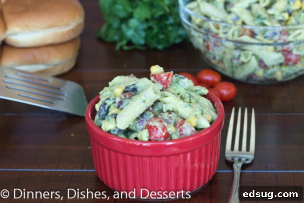 Creamy Avocado Pasta Salad | Dinners, Dishes, and Desserts Close-up of creamy avocado pasta salad showing detailed texture of pasta, corn, black beans, and avocado dressing