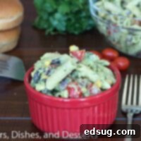 Velvety Avocado Pasta Salad 2 creamy avocado pasta salad in a bowl with cilantro garnish