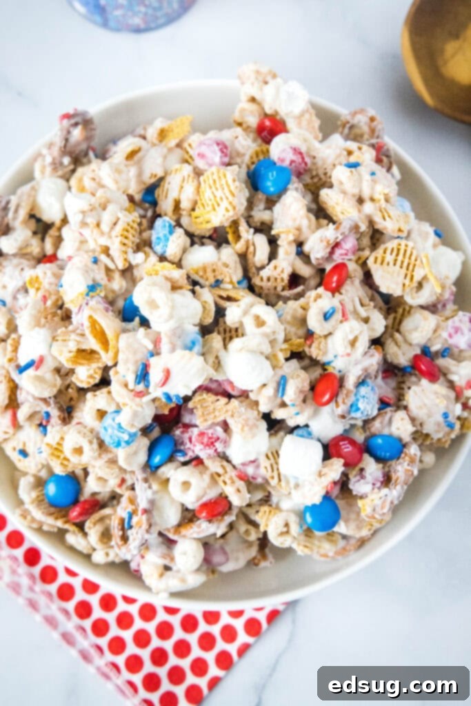 Stars & Stripes Party Blend 6 looking down on a bowl of 4th july snack mix, with a focus on its colorful red, white, and blue elements