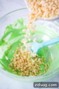 Watermelon Splash Krispies 4 adding krispies to melted green marshmallos