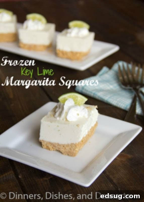 Delicious frozen key lime margarita squares served on a white plate, garnished with lime slices