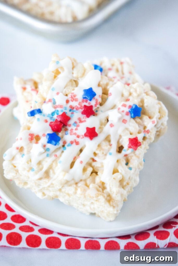 rice krispie treats decorated for the 4th of july on a white plate