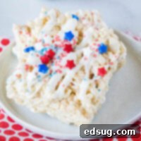 close up rice krispie treats with red and blue sprinkles