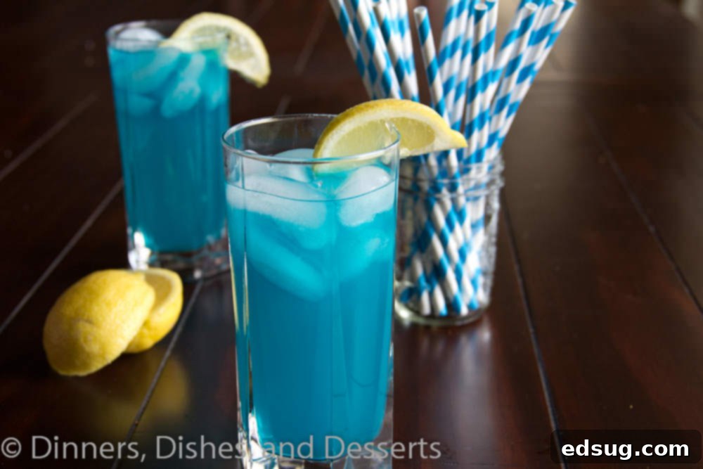 Easy Blue Vodka Lemonade for Any Occasion Close-up of a refreshing blue vodka lemonade drink with ice and a citrus garnish