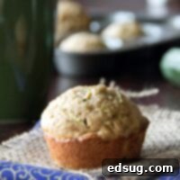 Freshly baked zucchini muffins on a napkin, with a blurred background.